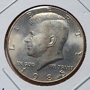 1985-D Kennedy Half Dollar... Uncirculated... Toning... In Protective Holder